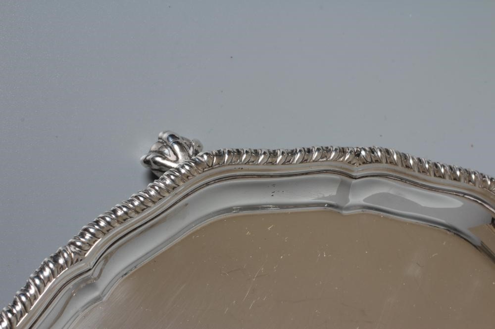 A GEORGE V WAITER by Richard Burbridge for Harrods, London 1935, of shaped circular form with Image