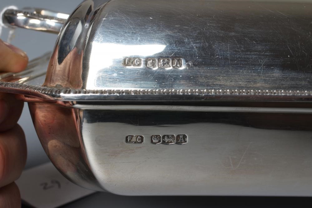 A GEORGE VI SILVER ENTRÉE DISH AND TWO HANDLED COVER by Frank Cobb & Co Ltd. Image