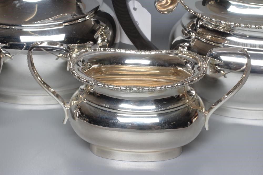 A GEORGE VI SILVER FOUR PIECE TEA SERVICE by Viners Image