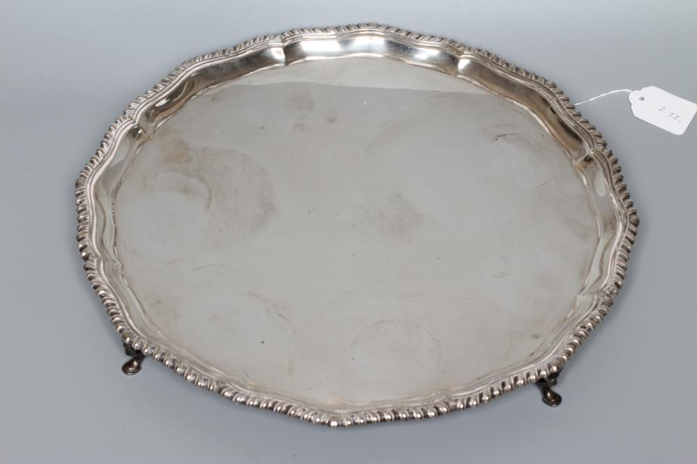 A GEORGE V SILVER SALVER by R F Mosley & Co., Sheffield 1929, of shaped circular form with gadrooned Image