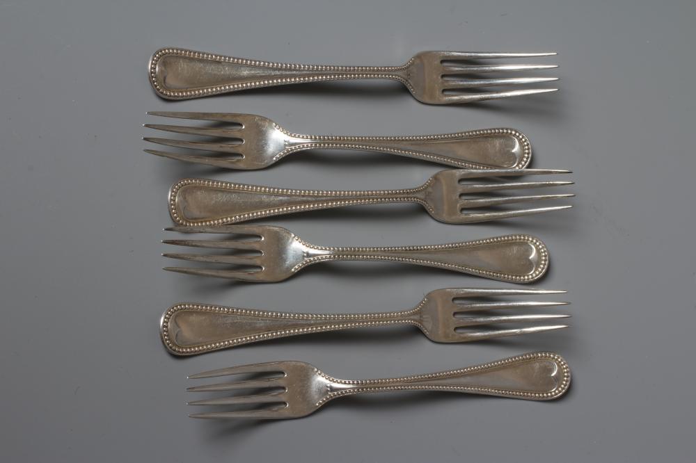 A SET OF SIX SILVER BEAD PATTERN DESSERT FORKS, maker's mark indistinct, stamped STERLING, 7ozs Image