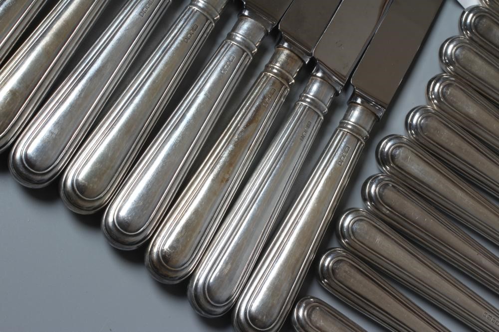 AN ELIZABETH II SET OF TWELVE EACH SILVER TABLE AND DESSERT KNIVES by William Yates Ltd., Sheffield Image