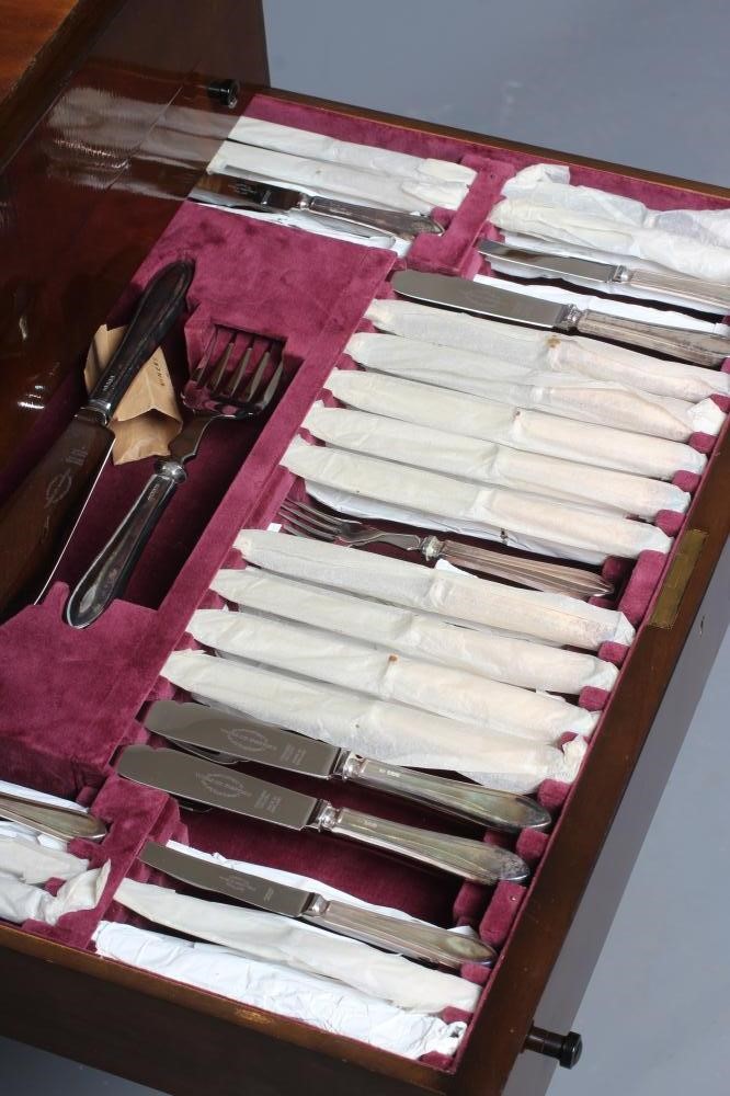 AN ELIZABETH II FULL AND COMPLETE SILVER SANDRINGHAM PATTERN TABLE SERVICE FOR TWELVE PLACE SETTINGS Image