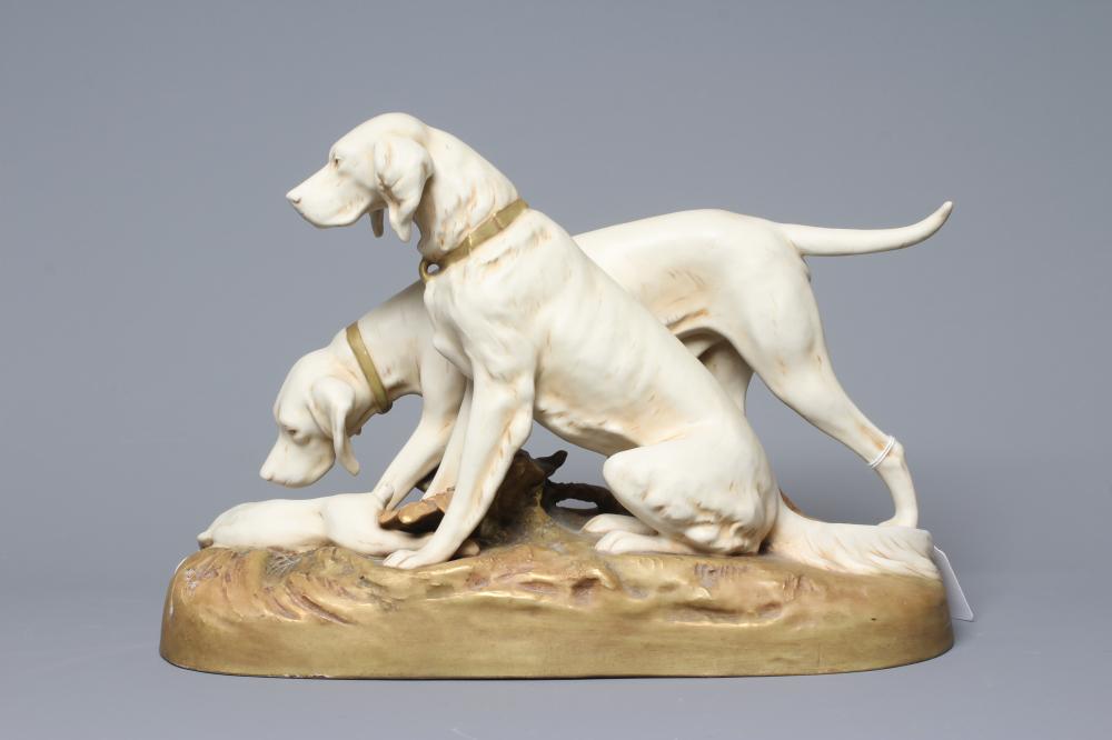 A ROYAL DUX MODEL OF TWO RETRIEVERS, early 20th century, with a dead hare on a naturalistically Image