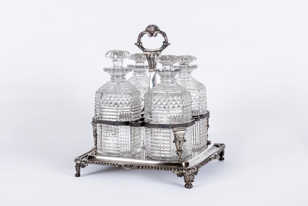 A LATE GEORGE III SILVER QUADRUPLE DECANTER STAND by Daniel Pontifex Image