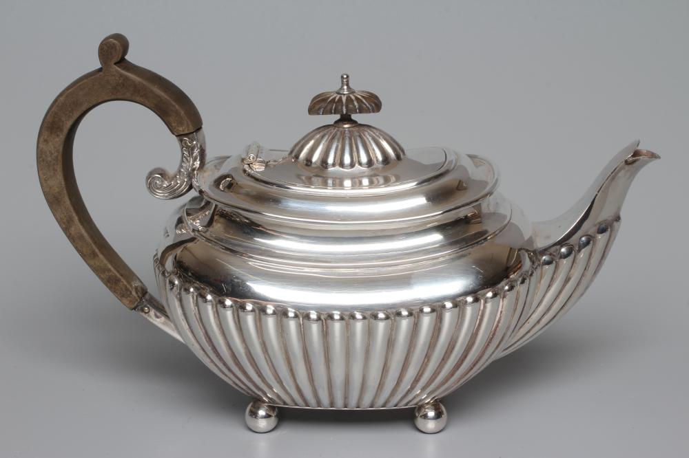 AN EDWARDIAN SILVER TEAPOT by James Dixon & Sons Ltd. Image