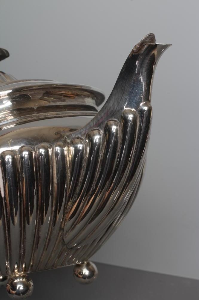 AN EDWARDIAN SILVER TEAPOT by James Dixon & Sons Ltd. Image