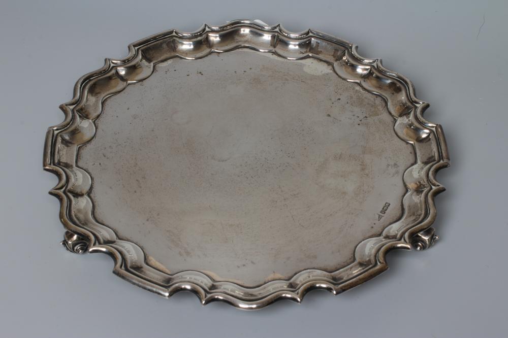 A GEORGE V SILVER SALVER by Walker & Hall, Sheffield 1910, of shaped circular form with piecrust Image