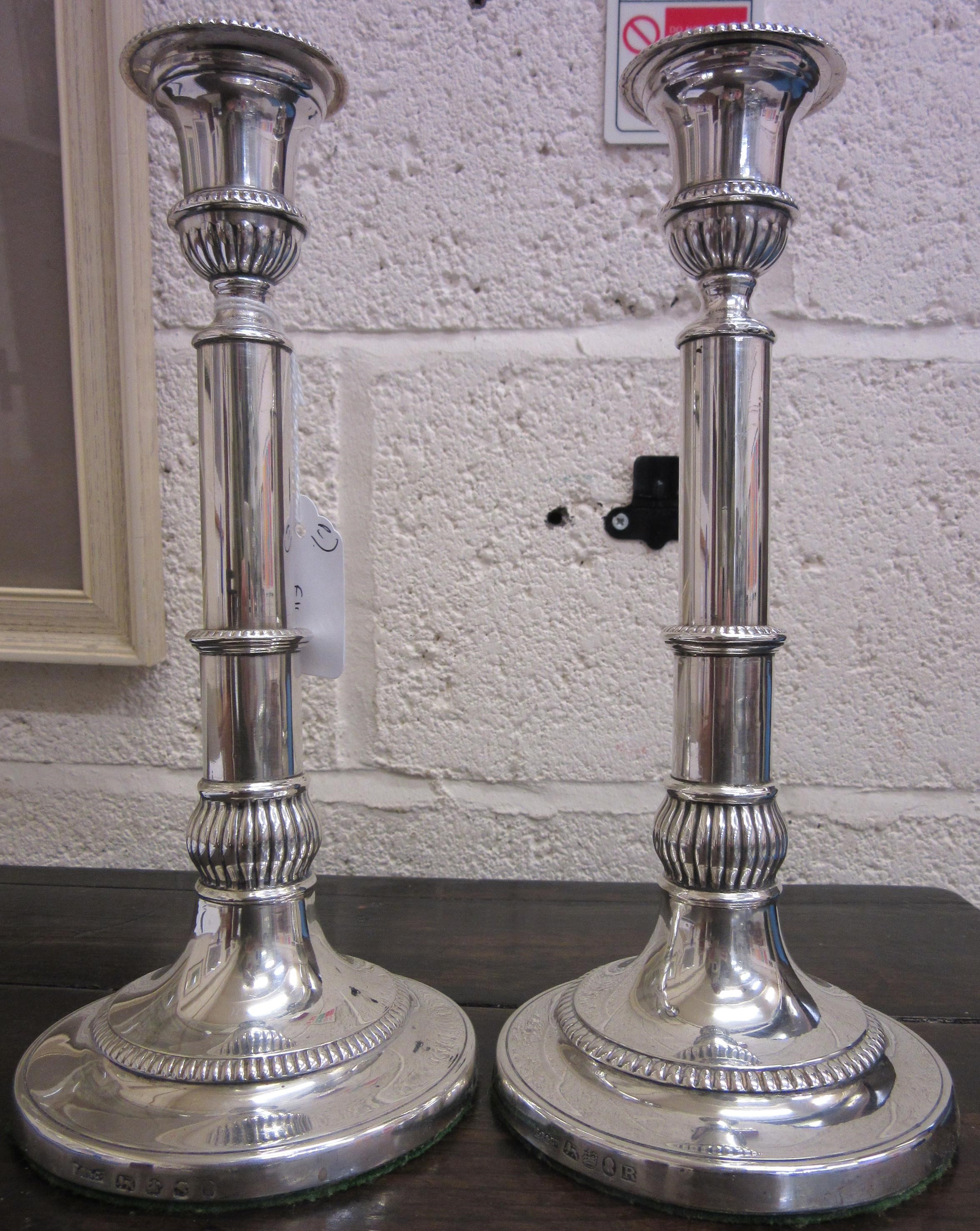A COMPOSITE PAIR OF GEORGE III SILVER TELESCOPIC CANDLESTICKS by John Roberts & Sons Image