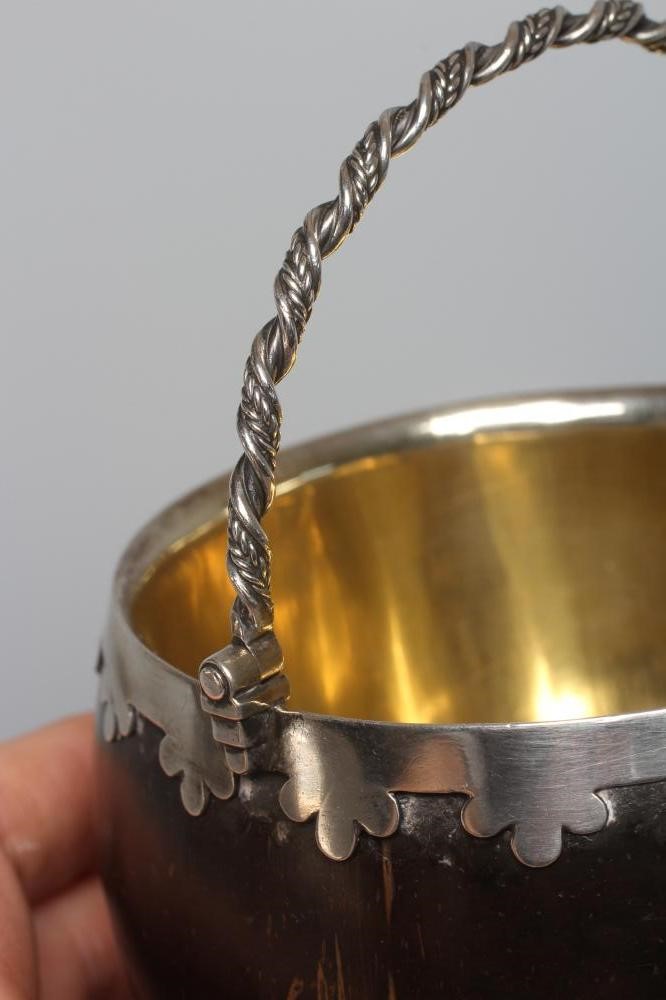 AN EARLY VICTORIAN SILVER MOUNTED COCONUT BASKET by the Barnards Image