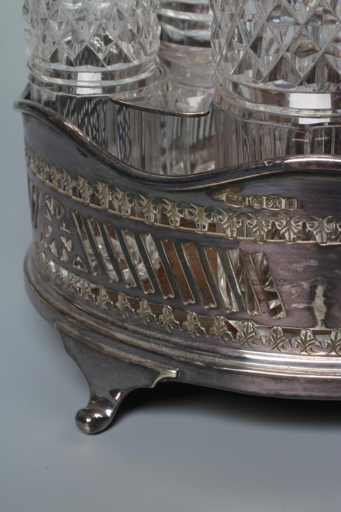 A LATE VICTORIAN SILVER FIVE BOTTLE CRUET STAND by Atkin Brothers Image