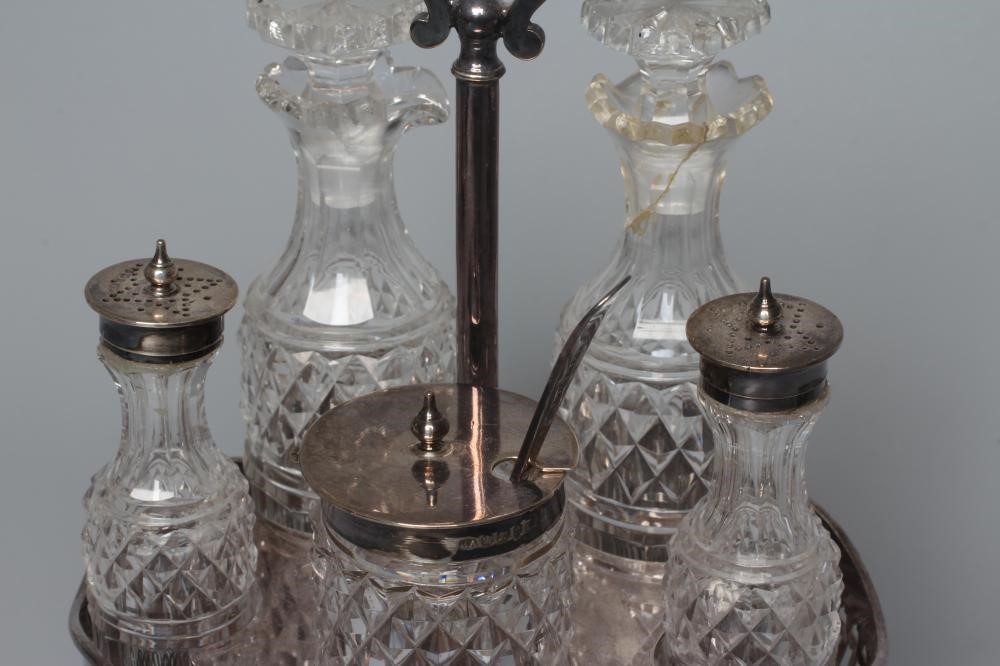 A LATE VICTORIAN SILVER FIVE BOTTLE CRUET STAND by Atkin Brothers Image