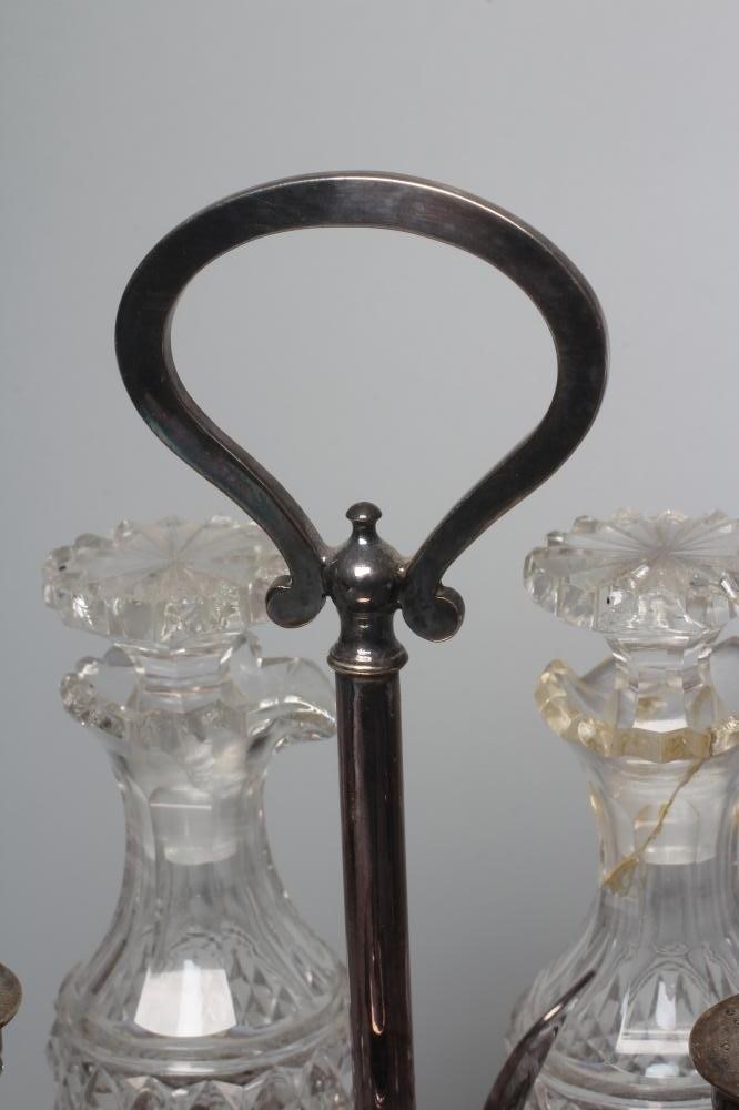 A LATE VICTORIAN SILVER FIVE BOTTLE CRUET STAND by Atkin Brothers Image