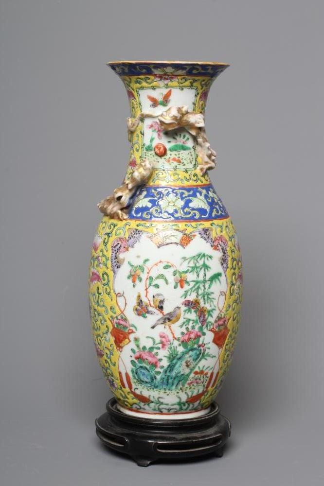 A CHINESE PORCELAIN FAMILLE JEUNE VASE of baluster form with chi-long moulded and applied to the Image