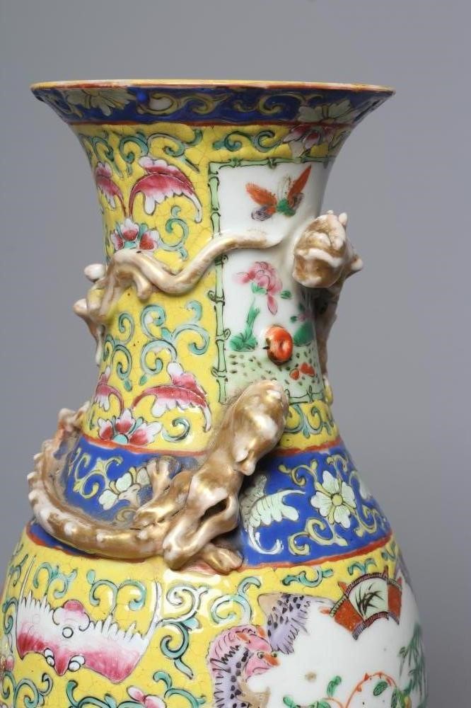 A CHINESE PORCELAIN FAMILLE JEUNE VASE of baluster form with chi-long moulded and applied to the Image