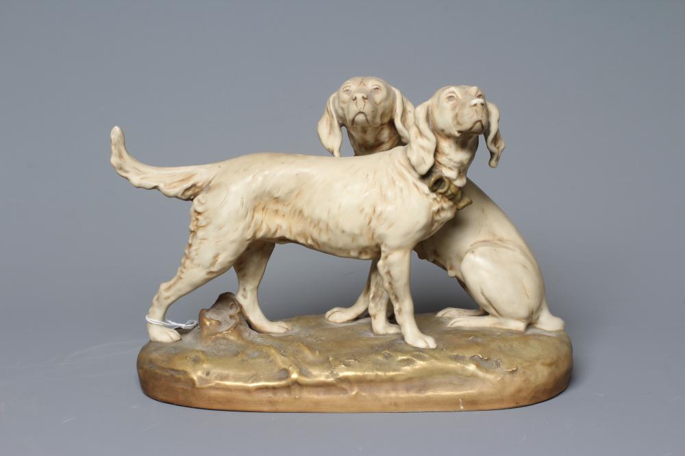 A ROYAL DUX MODEL OF TWO SETTERS, one seated and one standing on a naturalistically moulded oval Image