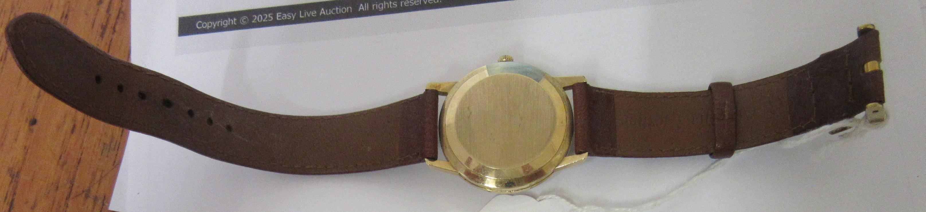 A GENTLEMAN'S 9CT GOLD OMEGA AUTOMATIC WRISTWATCH Image