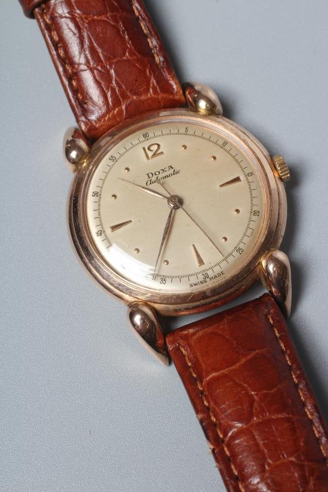 A GENTLEMAN'S 14CT GOLD DOXA AUTOMATIC WRISTWATCH Image