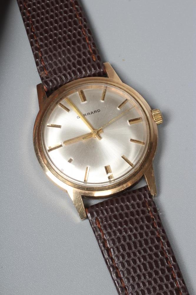 A GENTLEMAN'S GARRARD WRISTWATCH, the silvered dial with applied gold batons and centre seconds, in Image