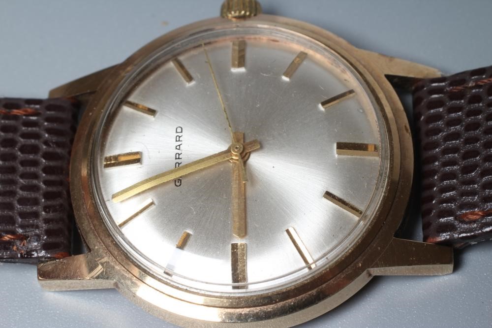 A GENTLEMAN'S GARRARD WRISTWATCH, the silvered dial with applied gold batons and centre seconds, in Image