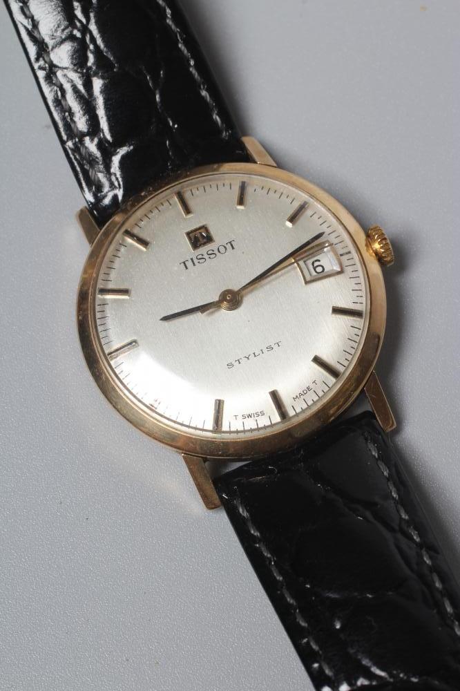 A GENTLEMAN'S 9CT GOLD TISSOT WRISTWATCH, the silvered dial with applied gold batons, date aperture Image
