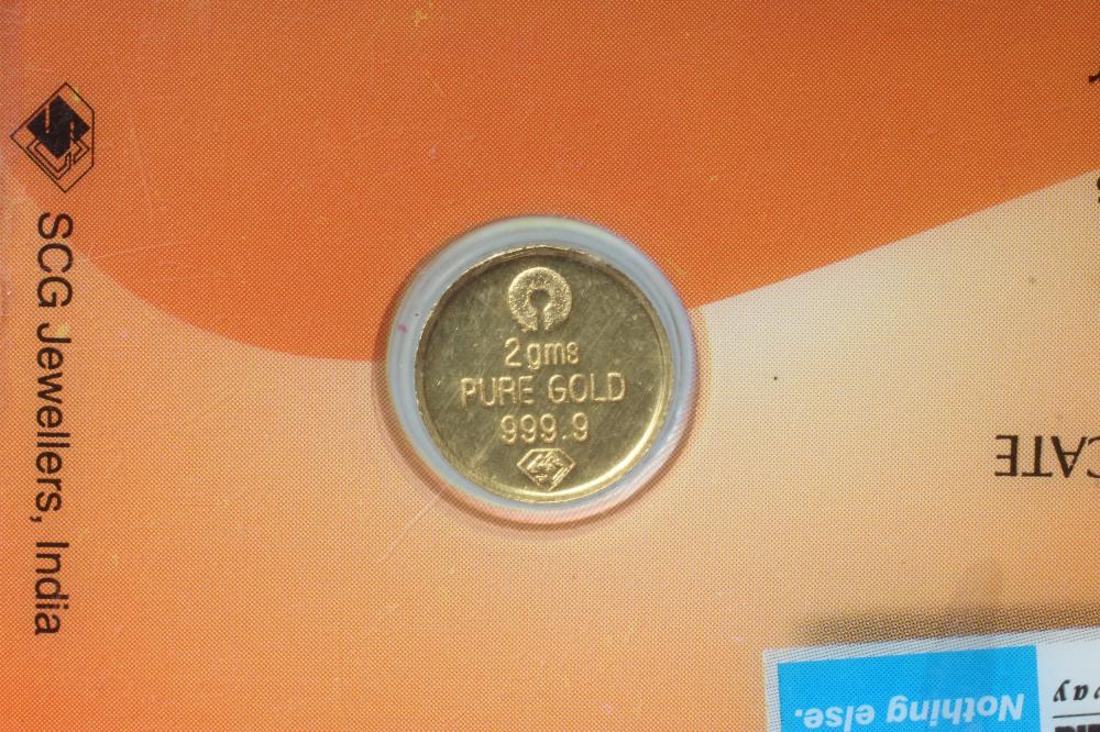 A STATE BANK OF INDIA 'PURE GOLD' PIECE, in sealed credit card, fineness stamped 999.9, 2gms Image