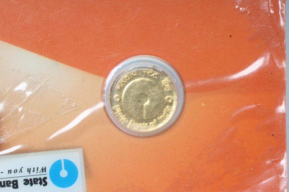 A STATE BANK OF INDIA 'PURE GOLD' PIECE, in sealed credit card, fineness stamped 999.9, 2gms Image