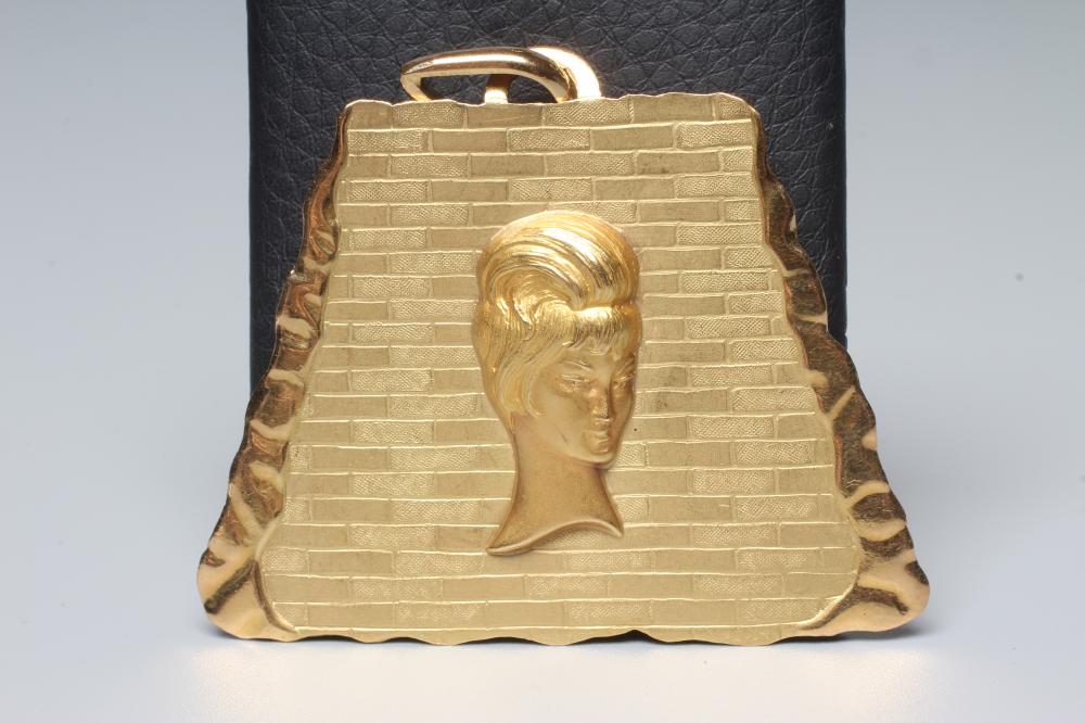AN ITALIAN TRAPEZIUM SHAPED PENDANT stamped 750, centred by the head portrait of a young lady with a Image