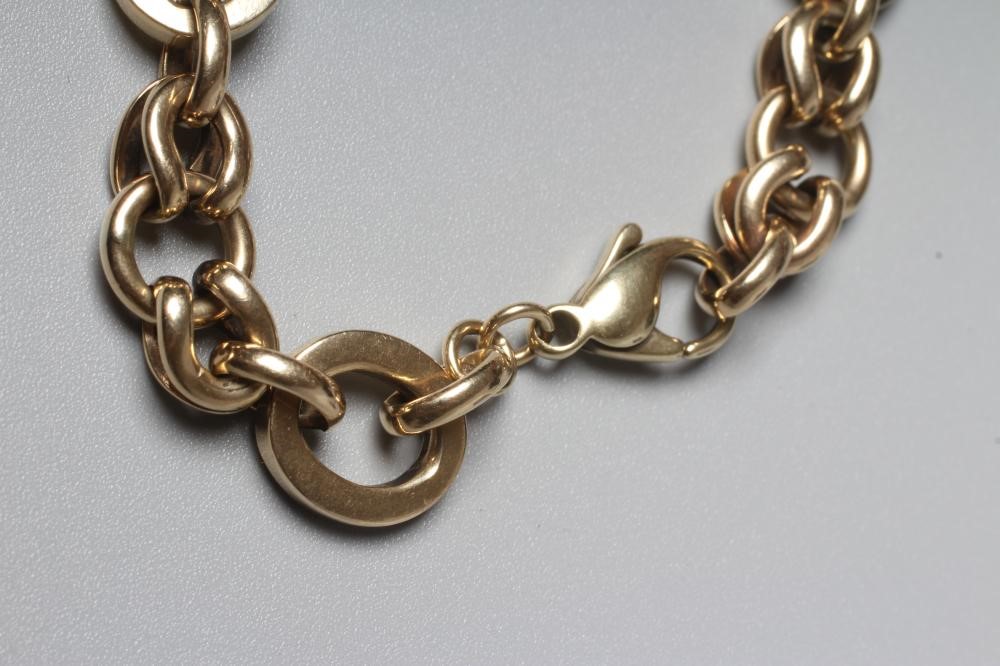 A SNAFFLE LINK BRACELET stamped 375, the five larger links with five sets of triple links between Image