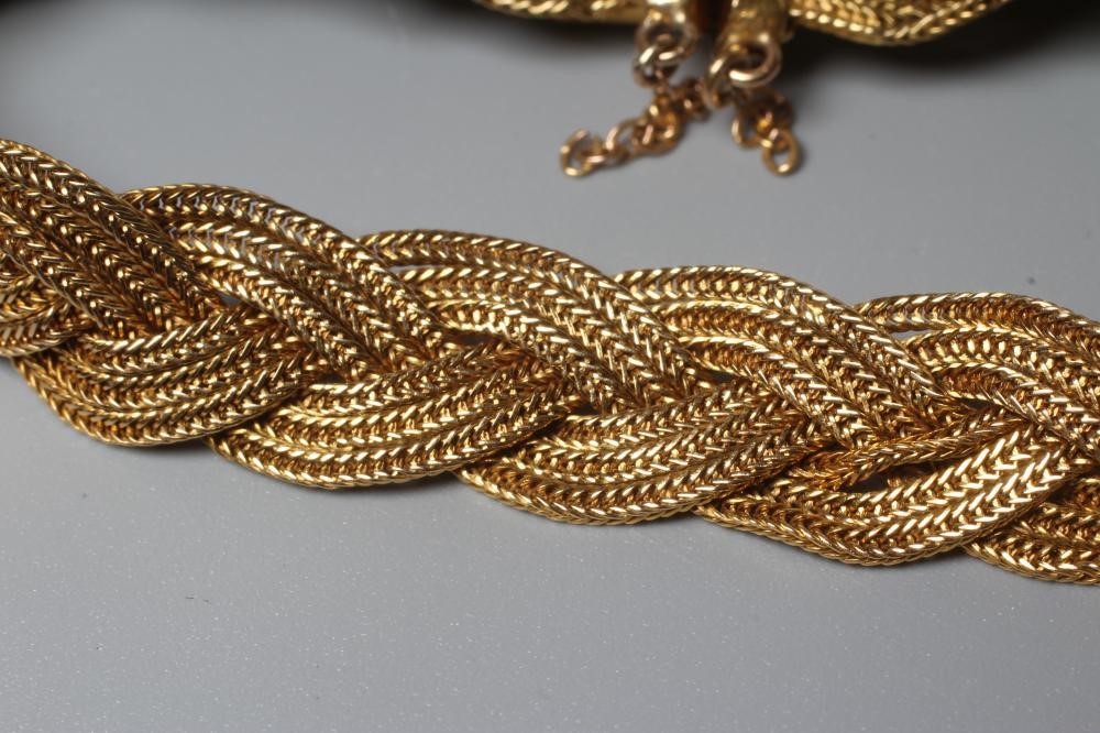 AN ITALIAN BRACELET BY UNOERRE OF AREZZO, stamped 750, the three strand plait with tongue fastener, Image