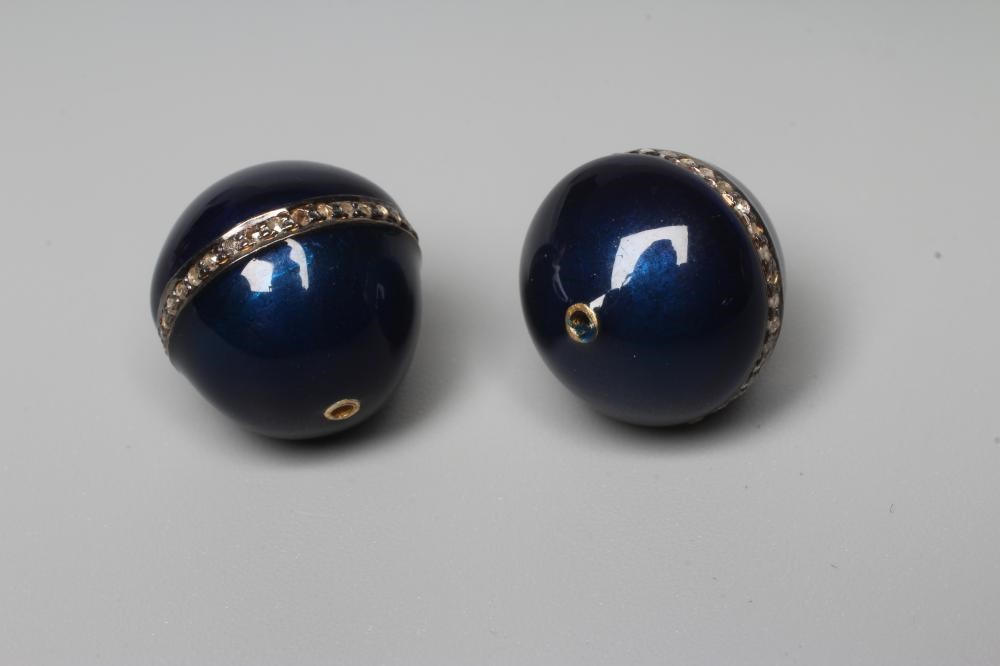 A PAIR OF BLUE ENAMELLED BEADS, each sphere with an inset band of small point set round cut diamonds Image