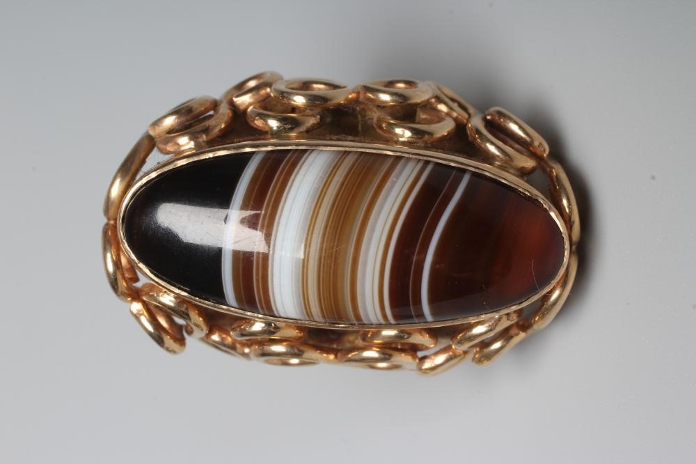A HARDSTONE DRESS RING Image