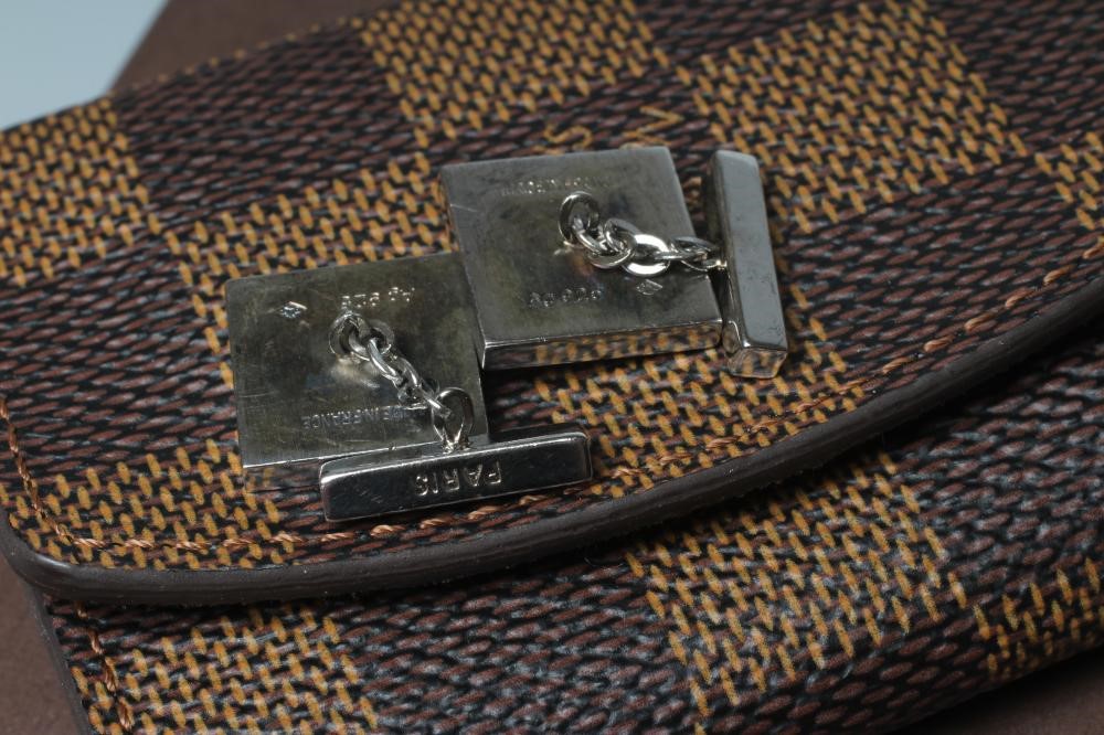 A PAIR OF LOUIS VUITTON SILVER CUFFLINKS, stamped Ag 925, the square panels with a black, green and Image