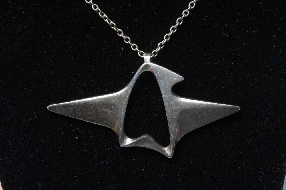 A GEORG JENSEN SILVER ABSTRACT PENDANT designed by Henning Koppel, on original chain, stamped 925 S Image