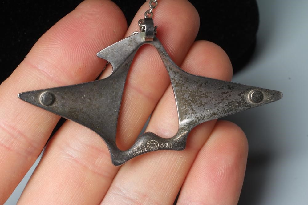 A GEORG JENSEN SILVER ABSTRACT PENDANT designed by Henning Koppel, on original chain, stamped 925 S Image