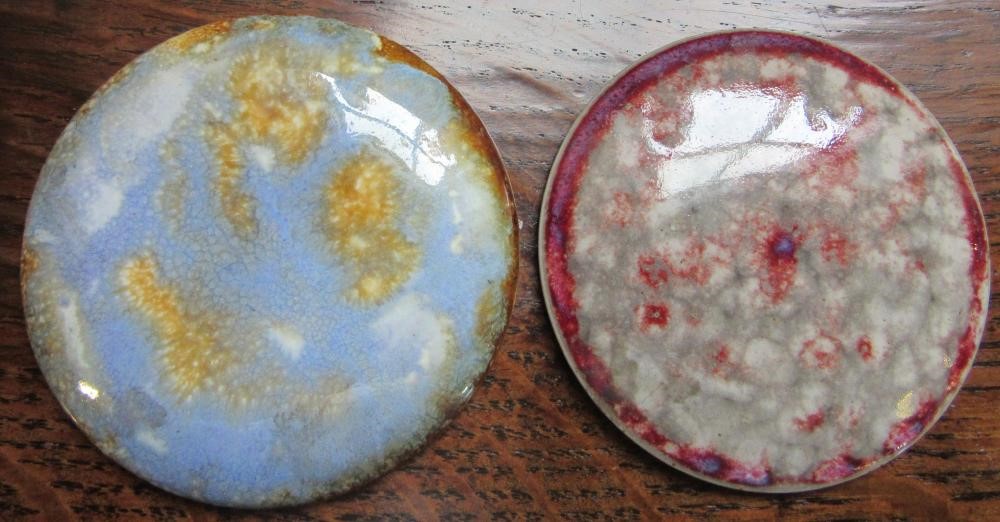 TEN RUSKIN POTTERY ROUNDELS in various glazes Image