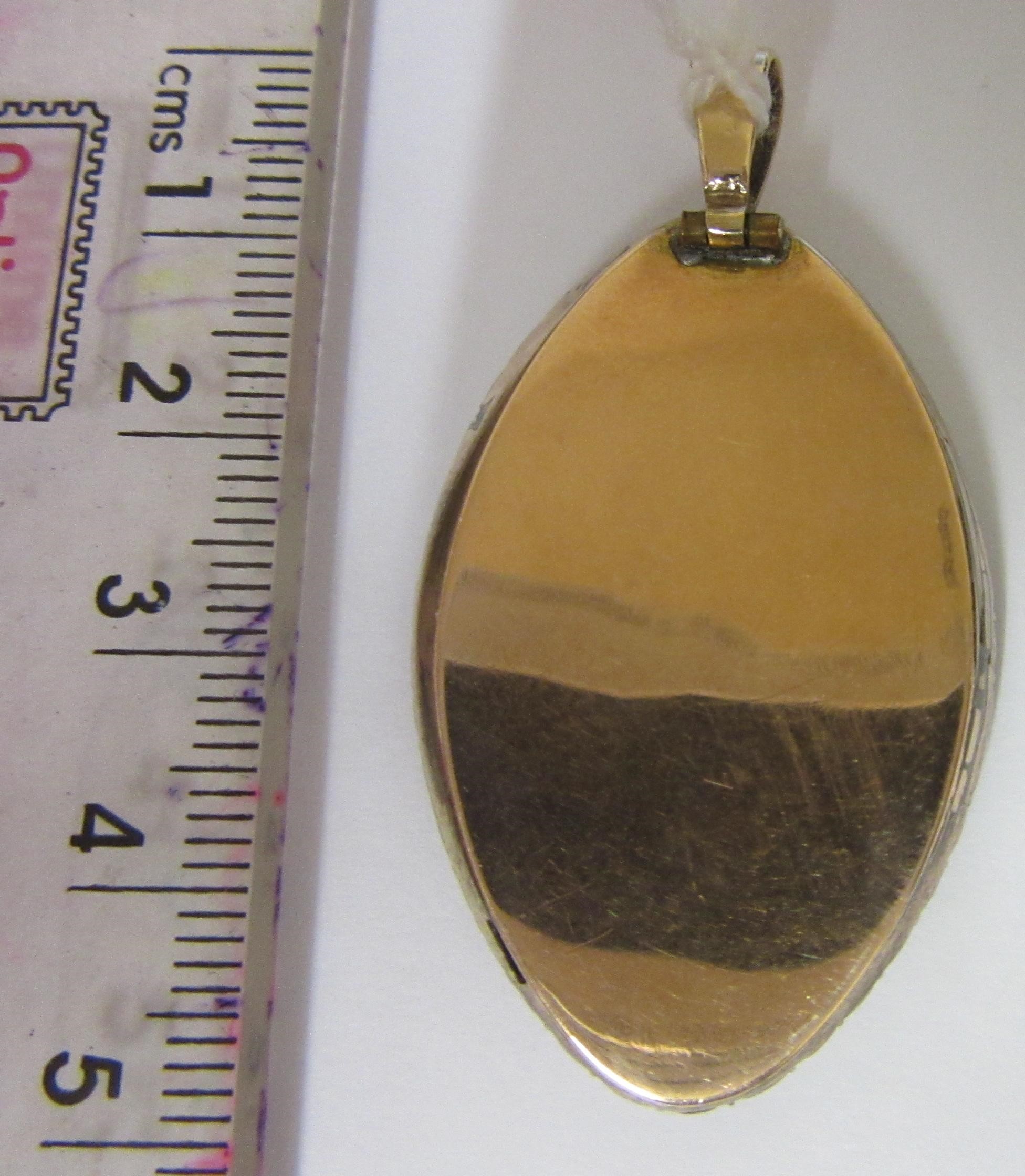 A GEORGIAN PENDANT inset with an eliptical ivory portrait miniature painted with the bust portrait Image