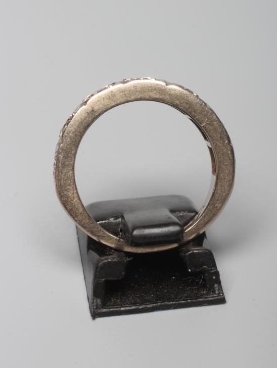 A SEVEN STONE DIAMOND HALF HOOP RING Image