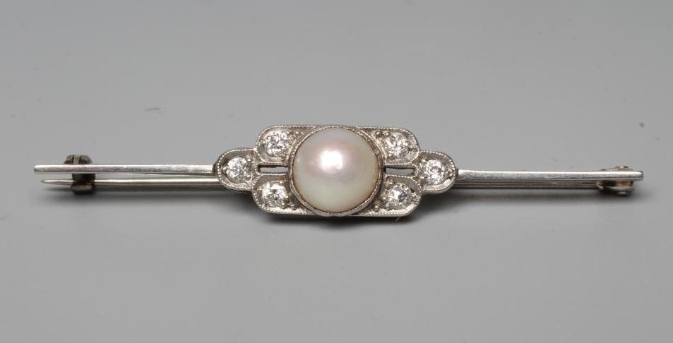 AN ART DECO PEARL AND DIAMOND BAR BROOCH, the central bouton in rub over setting with three small Image