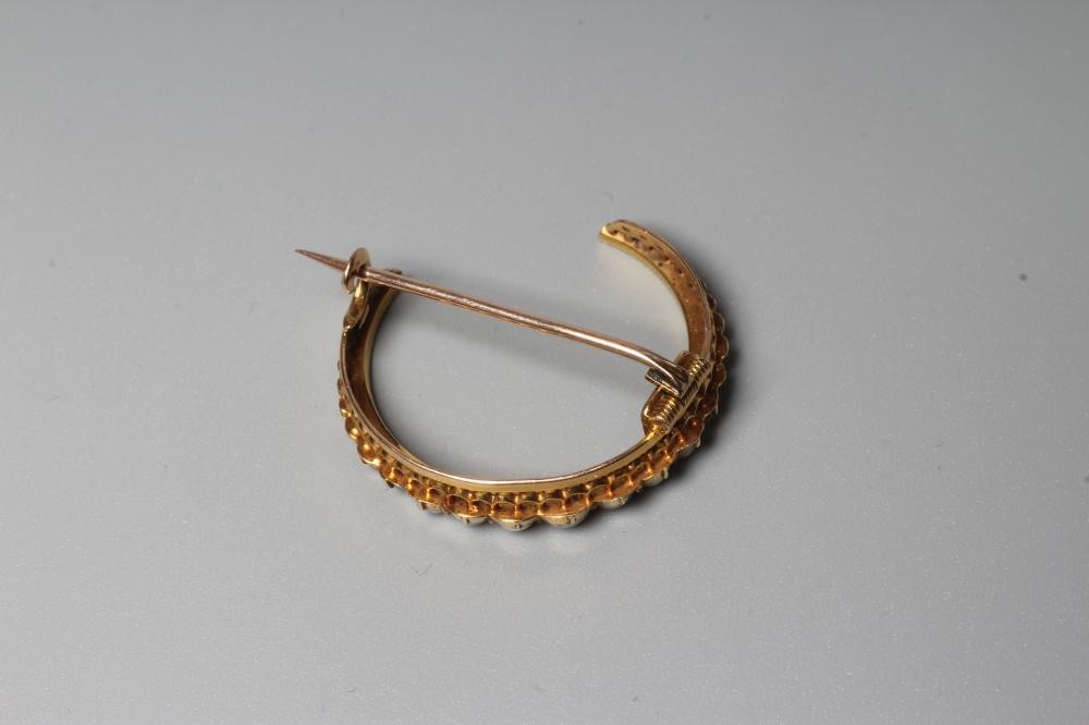 A VICTORIAN SEED PEARL CRESCENT BROOCH, the plain frame stamped 15 Image