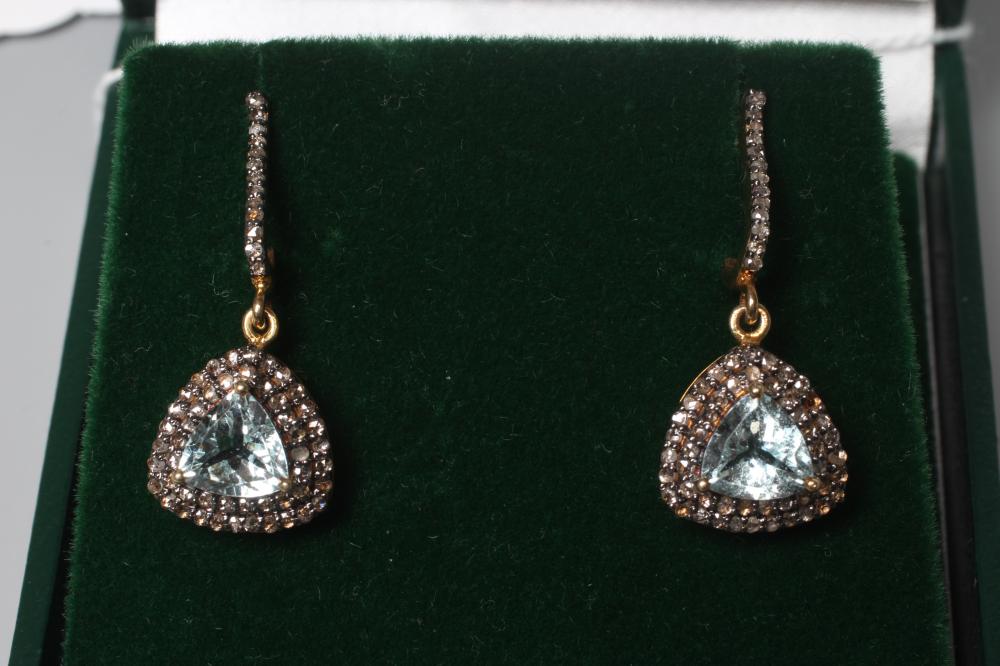 A PAIR OF AQUAMARINE AND DIAMOND DROP EAR STUDS, the facet cut triangular aquamarines claw set to a Image