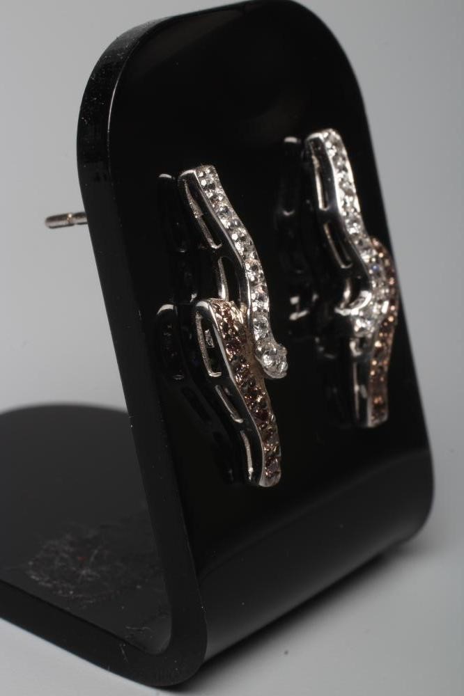 A PAIR OF BROWN AND WHITE DIAMOND EAR STUDS Image
