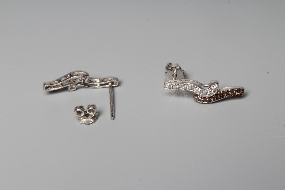 A PAIR OF BROWN AND WHITE DIAMOND EAR STUDS Image