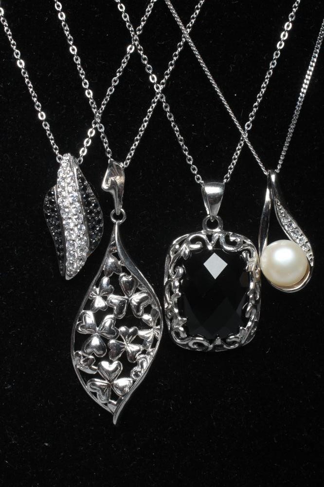 FIVE STONE SET SILVER PENDANTS including a leaf and a black glass bead rosary Image