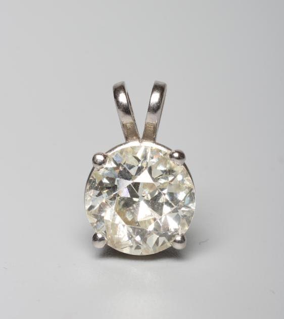 A SOLITAIRE DIAMOND PENDANT, the old cut stone of approximately 3cts, claw set to an unmarked white Image