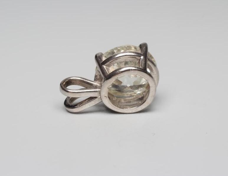 A SOLITAIRE DIAMOND PENDANT, the old cut stone of approximately 3cts, claw set to an unmarked white Image