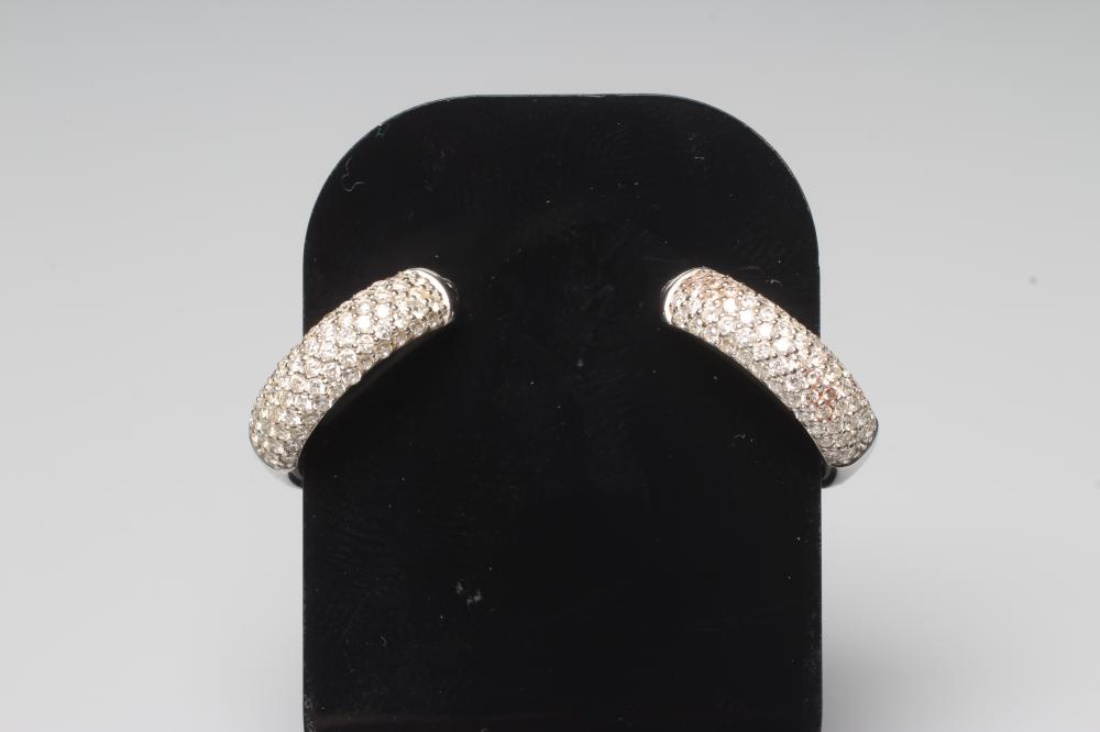 A PAIR OF DIAMOND EAR HOOPS pave set with numerous small brilliant cut stones to plain 18ct white Image