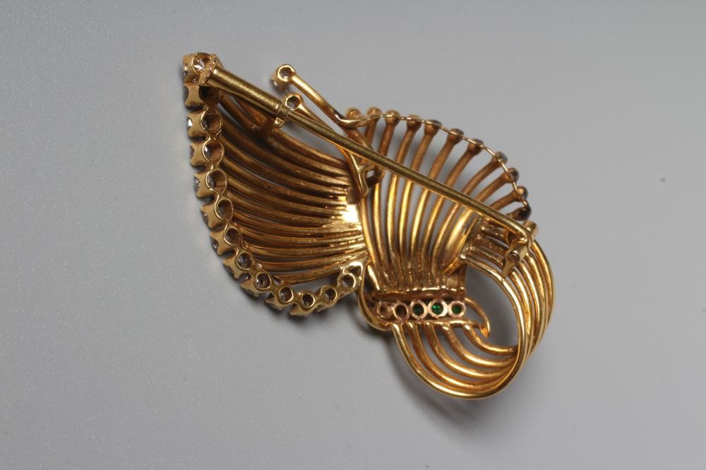 A MID CENTURY STYLISED SPRAY BROOCH claw set with fifteen small brilliant cut diamonds and five Image