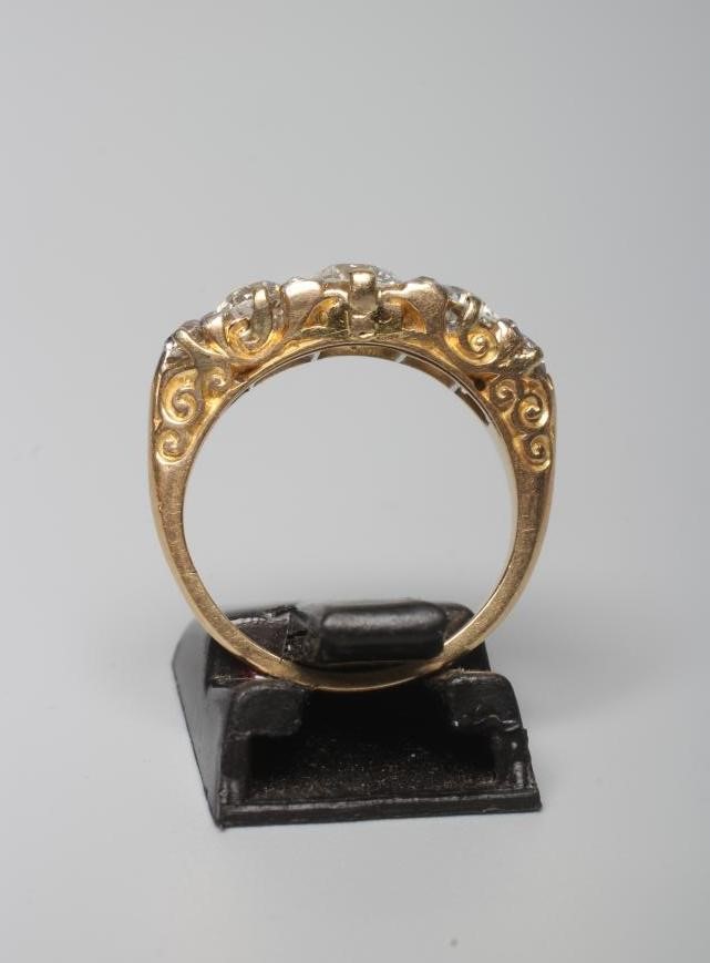 A FIVE STONE DIAMOND RING, the central brilliant cut stone of approximately 0.7cts claw set and Image