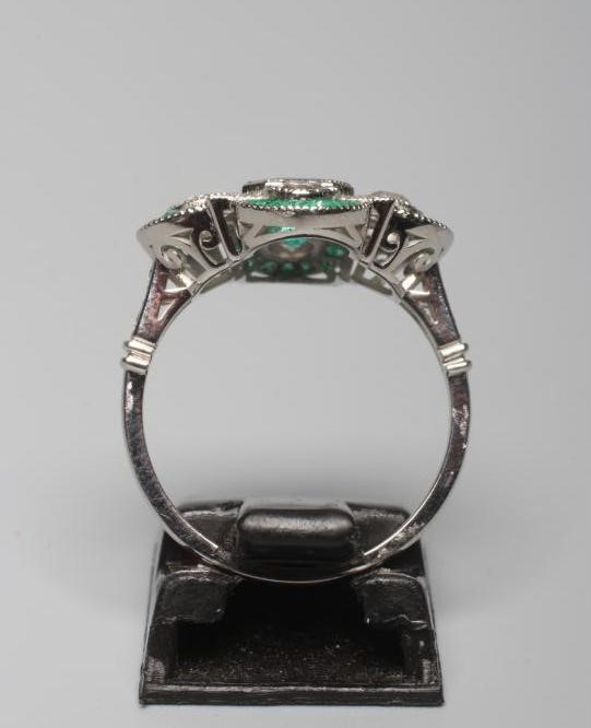 AN EMERALD AND DIAMOND DRESS RING Image
